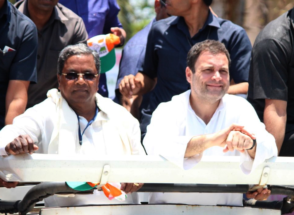 Ankola: Congress President Rahul Gandhi and Karnataka Chief Minister Siddaramaiah during road show for the upcoming Karnataka Assembly polls at Ankola in Uttara Kannada district of Karnataka on April 26, 2018. (Photo: IANS)