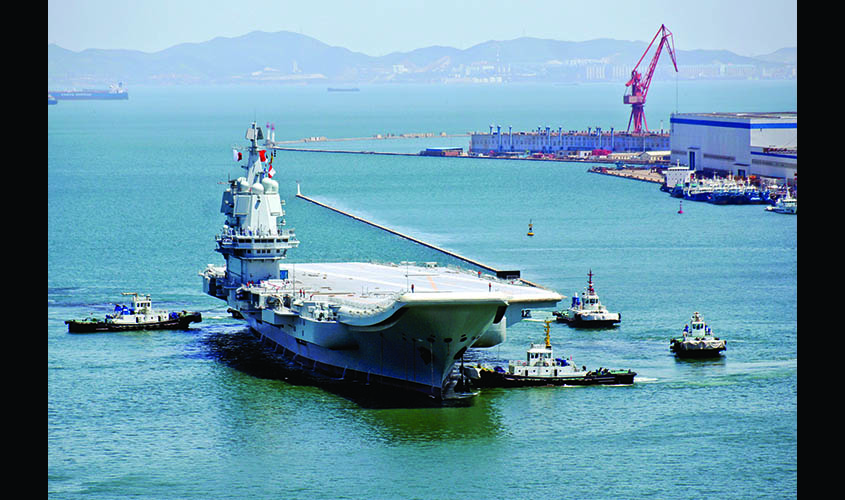 China's first domestically developed aircraft carrier is seen at a port in Dalian after completing its first sea trials