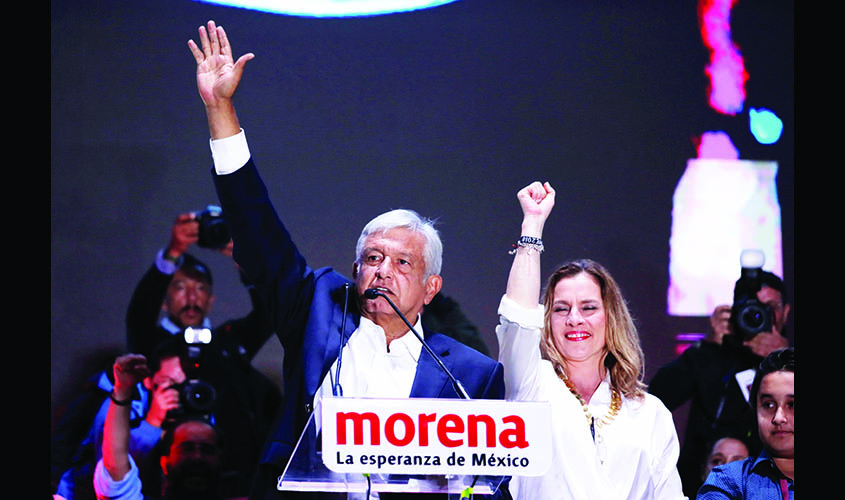 Presidential candidate Andres Manuel Lopez Obrador speaks next to his wife Beatriz Gutierrez Muller after winning the presidential election, in Mexico City