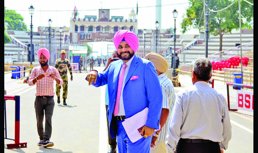 Punjab: Punjab Minister and former cricketer Navjot Singh Sidhu leaves to attend the oath-taking ceremony of Pakistan's Prime Minister-in-waiting Imran Khan via Attari border, in Punjab, on Aug 17, 2018. (Photo: IANS)