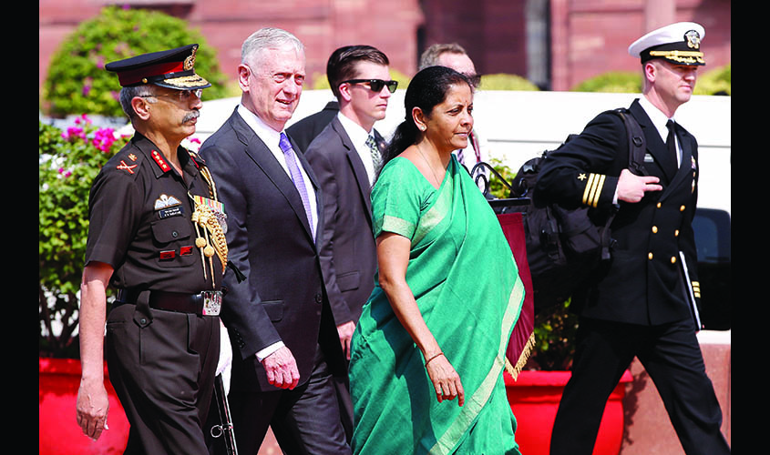 U.S. Defense Secretary Mattis inspects honour guard as India's Defence Minister Sitharaman looks on in New Delhi
