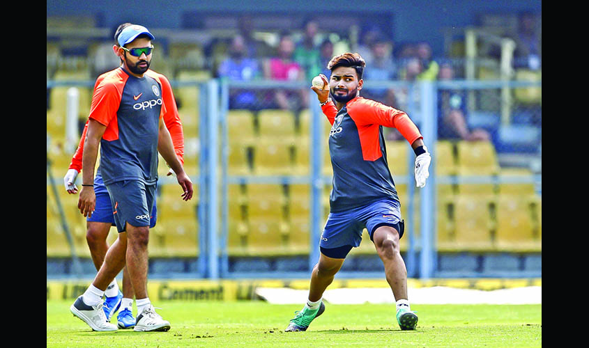 Guwahati: India's Rohit Sharma and Rishabh Pant during a practice session on the eve of first ODI match against West Indies in Guwahati, on Oct 20, 2018. (Photo: Surjeet Yadav/IANS)