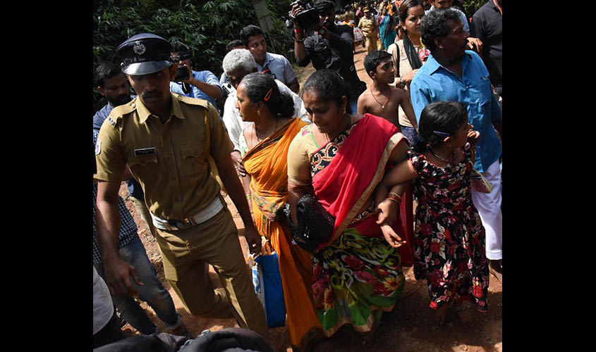Sabarimala: Women devotees attempt to enter Sabarimala temple in Kerala's Pathanamthitta District on Oct 17, 2018. Traditionalists opposed to the entry of women in the 10-50 age group to the Sabarimala temple despite a Supreme Court ruling took on the Ker