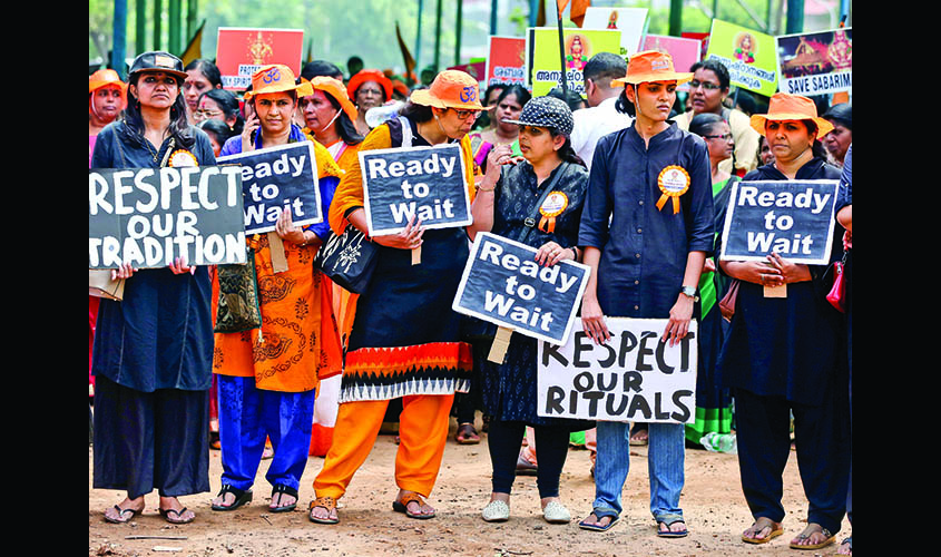 Women hold placards as they attend a protest march called by various Hindu organizations against the lifting of ban by Supreme Court that allowed entry of women of menstruating age to the Sabarimala temple, in Kochi