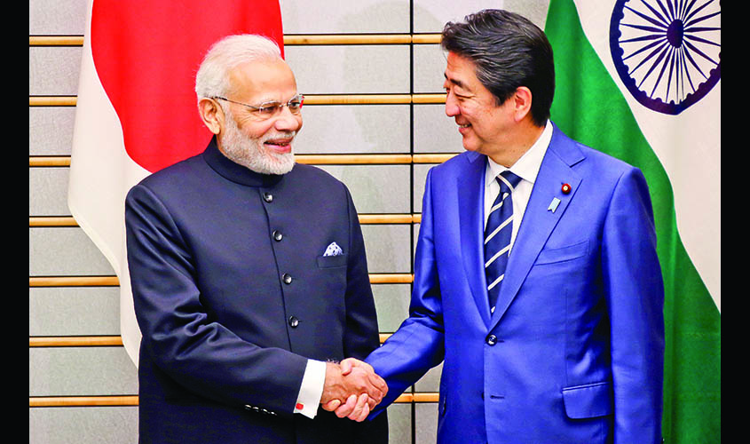 Indian Prime Minister Narendra Modi and Japan's Prime Minister Shinzo Abe shake hands prior to their meeting at Abe's official residence