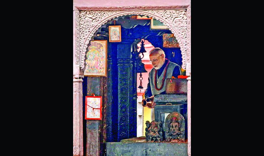 India's Prime Minister Narendra Modi offers prayer at the premises of Pashupatinath Temple in Kathmandu