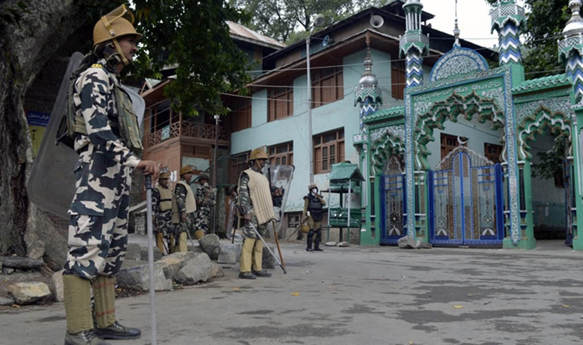 Baramulla: Security forces keep a strict vigil as authorities clamp curfew and restrictions amid protest shutdown called by separatists at Khanpora of Baramulla district in Jammu and Kashmir, on Aug 3, 2016. (Photo: IANS)