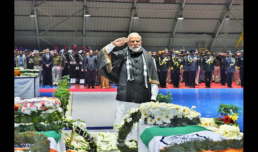 New Delhi: Prime Minister Narendra Modi saluting the CRPF personnel who were killed in a suicide attack by militants in Jammu and Kashmir's Pulwama district on 14th Feb 2019; at Palam Airport in New Delhi on Feb 15, 2019. (Photo: IANS/PIB)