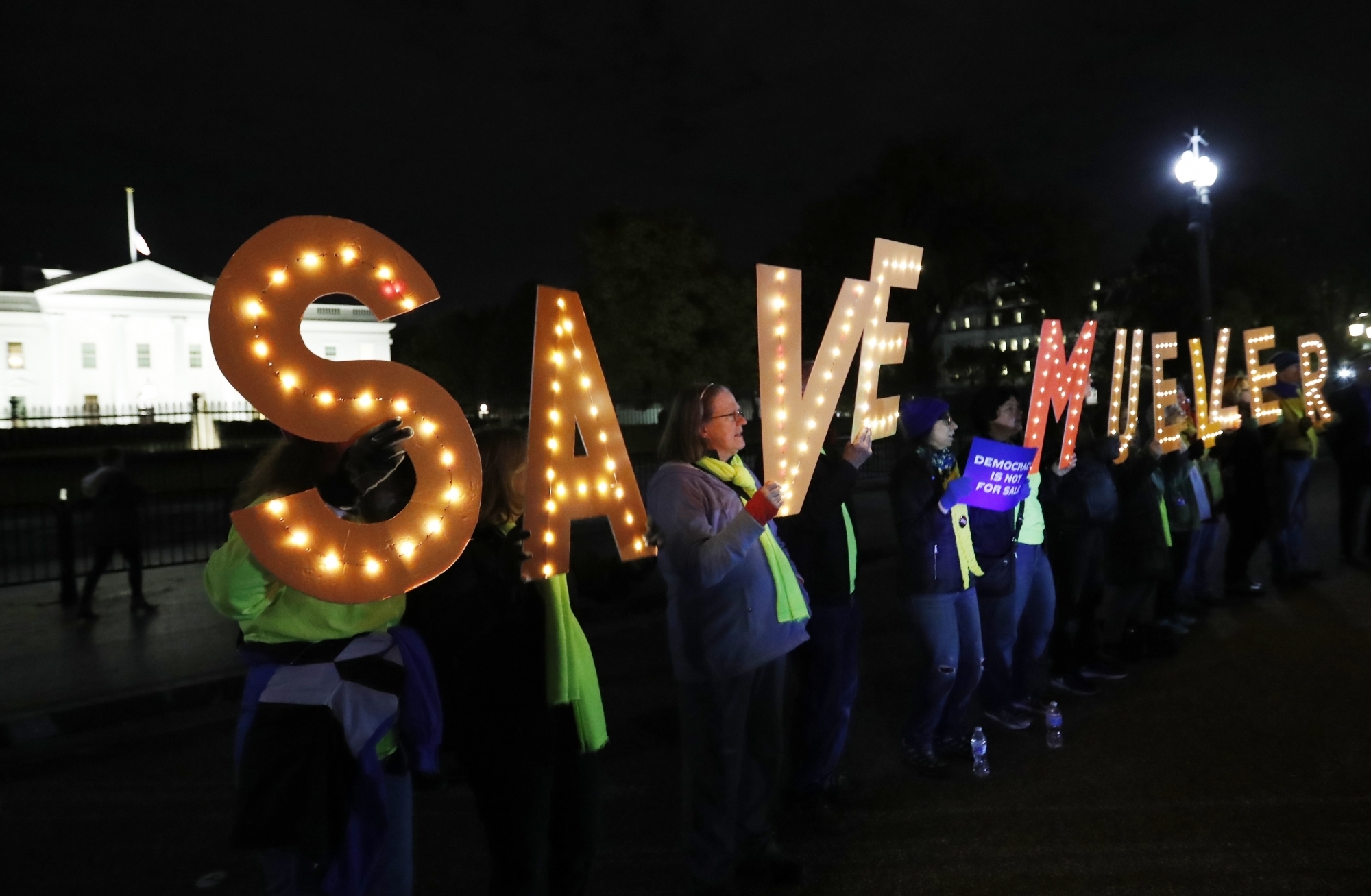 WASHINGTON, Nov. 9, 2018 (Xinhua) -- Protesters gather outside the White House holding signs reading