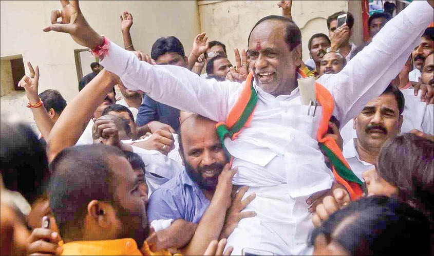 Telangana BJP president K. Laxman celebrating with party workers after the party led by Prime Minister Narendra Modi swept the Lok Sabha battle in Hyderabad on Thursday. IANS
