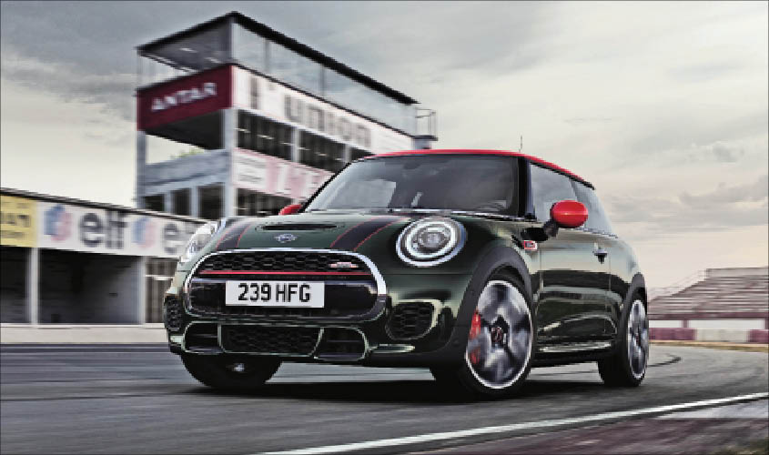 The Mini Cooper JCW gets a hexagonal radiator grille with honeycomb pattern, and the bonnet stripes add a racetrack-inspired look to the car.