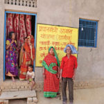 The Rajbhar family in front of their pucca house.