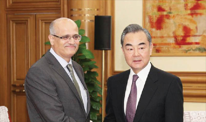 Foreign Secretary Vijay Keshav Gokhale shakes hands with Chinese State Councilor and Foreign Minister Wang Yi, in Beijing, China, on 22 April. REUTERS