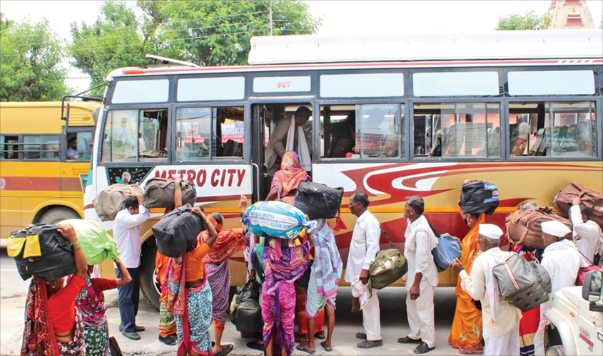 Amarnath pilgrims boarding a bus from Bhagwati Nagar base camp after the J&K administration on Friday advised tourists and yatris to curtail their stay in the Valley immediately. IANS