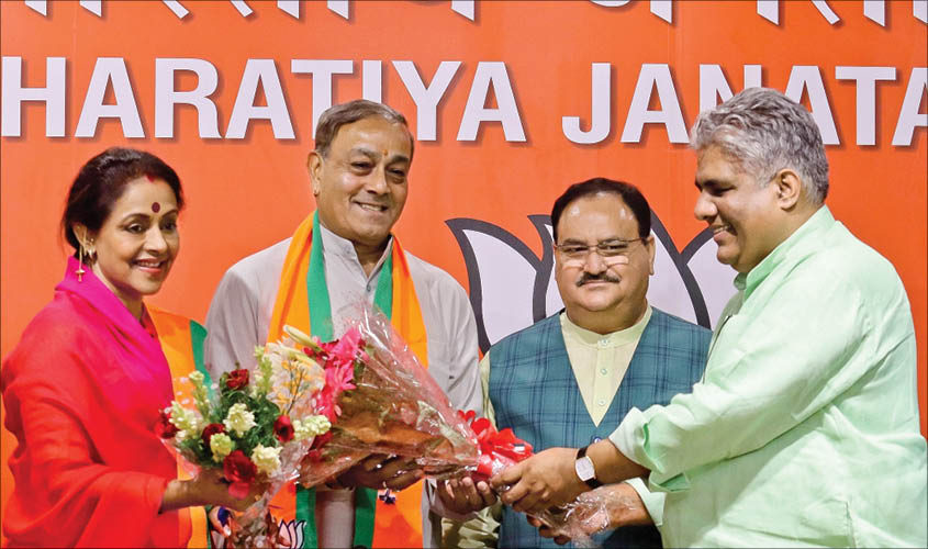 Former Congress leader Sanjay Singh welcomed into the BJP by party leaders J.P. Nadda and Bhupender Yadav, at the party’s headquarters in New Delhi, on Wednesday. IANS
