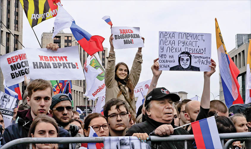 People attend a rally to demand authorities allow opposition candidates to run in the upcoming local election in Moscow, Russia on Saturday. REUTERS