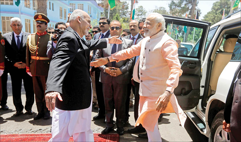 Afghanistan’s President Ashraf Ghani greets Prime Minister Narendra Modi before the inauguration of Salma Dam in Herat province, Afghanistan, on 4 June 2016. REUTERS
