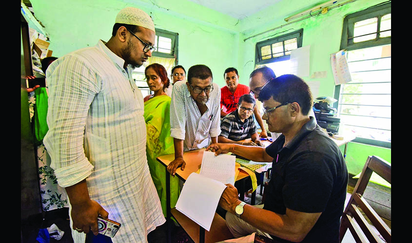 Nagaon: People get their names checked on the draft list at a National Register of Citizens (NRC) Centre in Nagaon, after an additional exclusion list comprising the names of 1,02,462 persons to the draft NRC was published in Assam, on June 26, 2019. (Pho