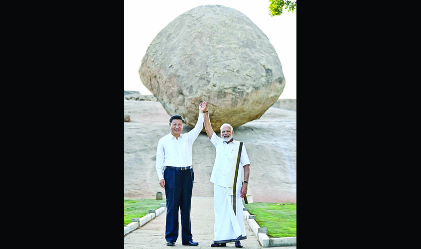 Mahabalipuram: Prime Minister Narendra Modi and Chinese President Xi Jinping during their visit to Krishna's butterball - a gigantic granite boulder sitting firmly on the slope of a hillock - in Mahabalipuram, Tamil Nadu on Oct 11, 2019. (Photo: IANS/PIB)
