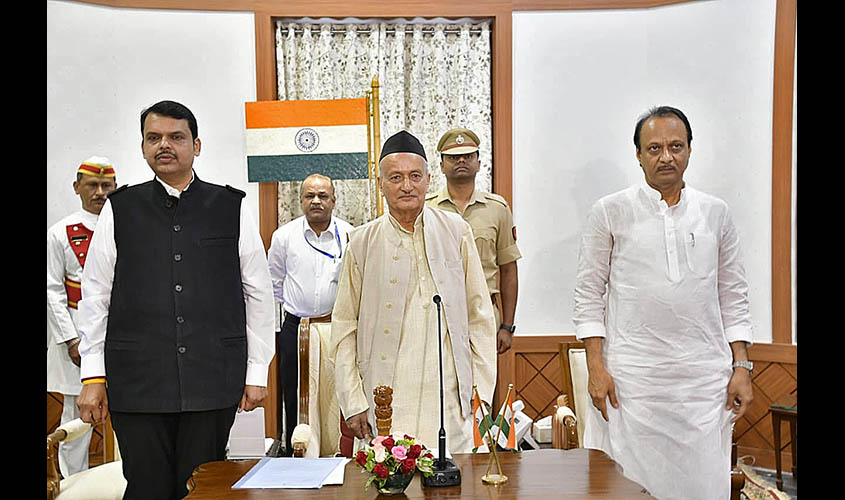 Mumbai: Maharashtra Governor B.S. Koshyari administering the oath of office to Bharatiya Janata Party leader Devendra Fadnavis as the Chief Minister and Nationalist Congress Party leader Ajit Pawar as the Deputy Chief Minister of Maharashtra in Mumbai on