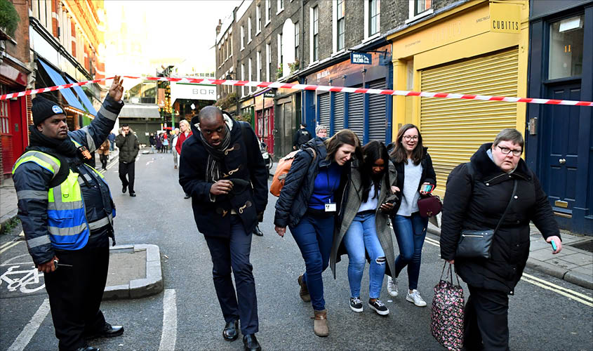 People leave the area near Borough Market after terrorist incident at London Bridge, in London, Britain on Friday. REUTERS