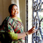 Former bandit queen Phoolan Devi smiles in her hotel room in Bombay, April 21 after she was nominate..