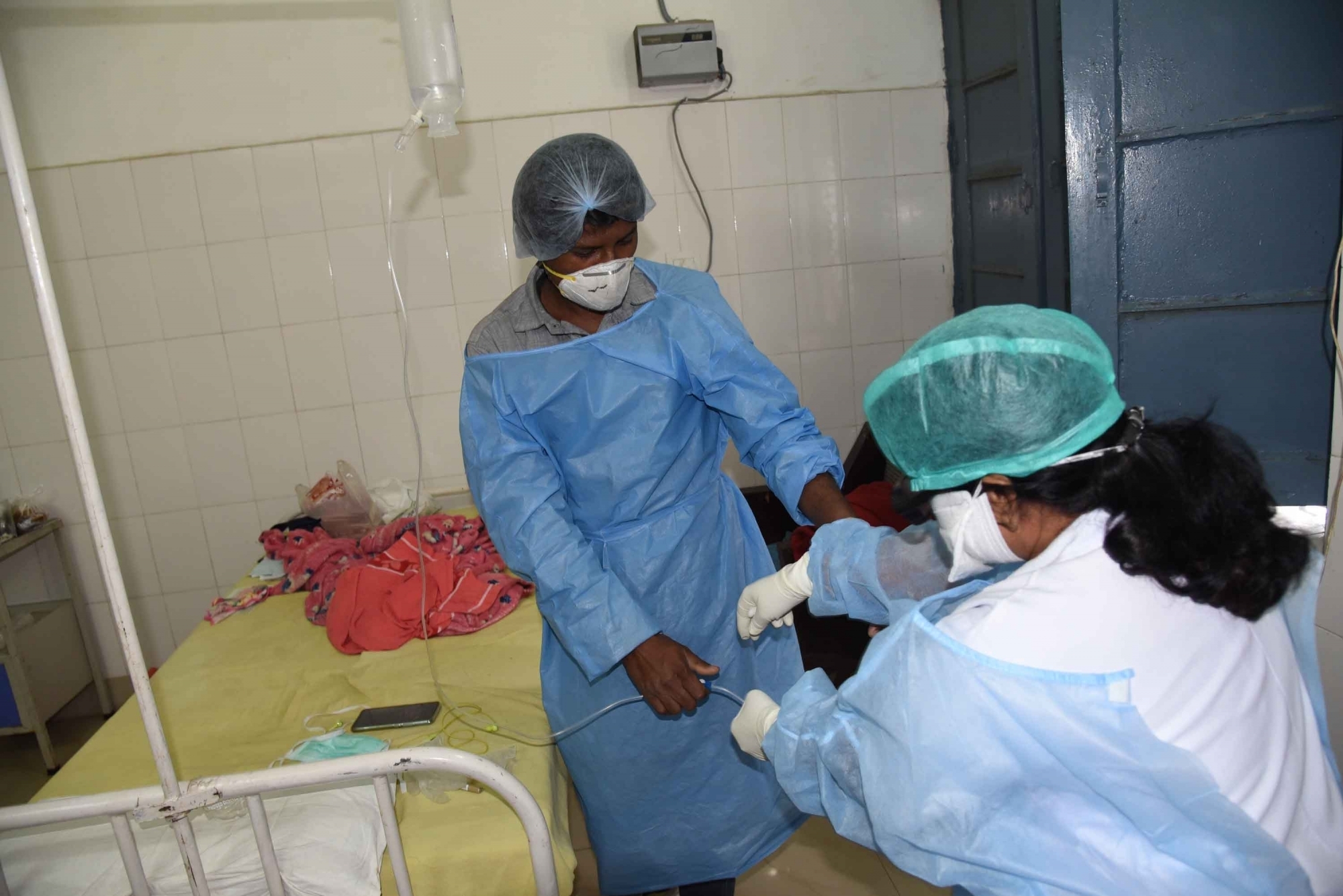 Patna: A doctor collects the blood sample of a suspected Coronavirus victim at the isolation ward of Patna Medical College and Hospital (PMCH), on March 15, 2020. (Photo: IANS)