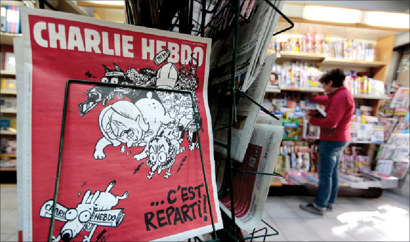 The front page of the new issue of satirical French weekly Charlie Hebdo entitled ‘C’est Reparti’ (‘Here we go again’), displayed at a kiosk in Nice on February 25, 2015. REUTERS
