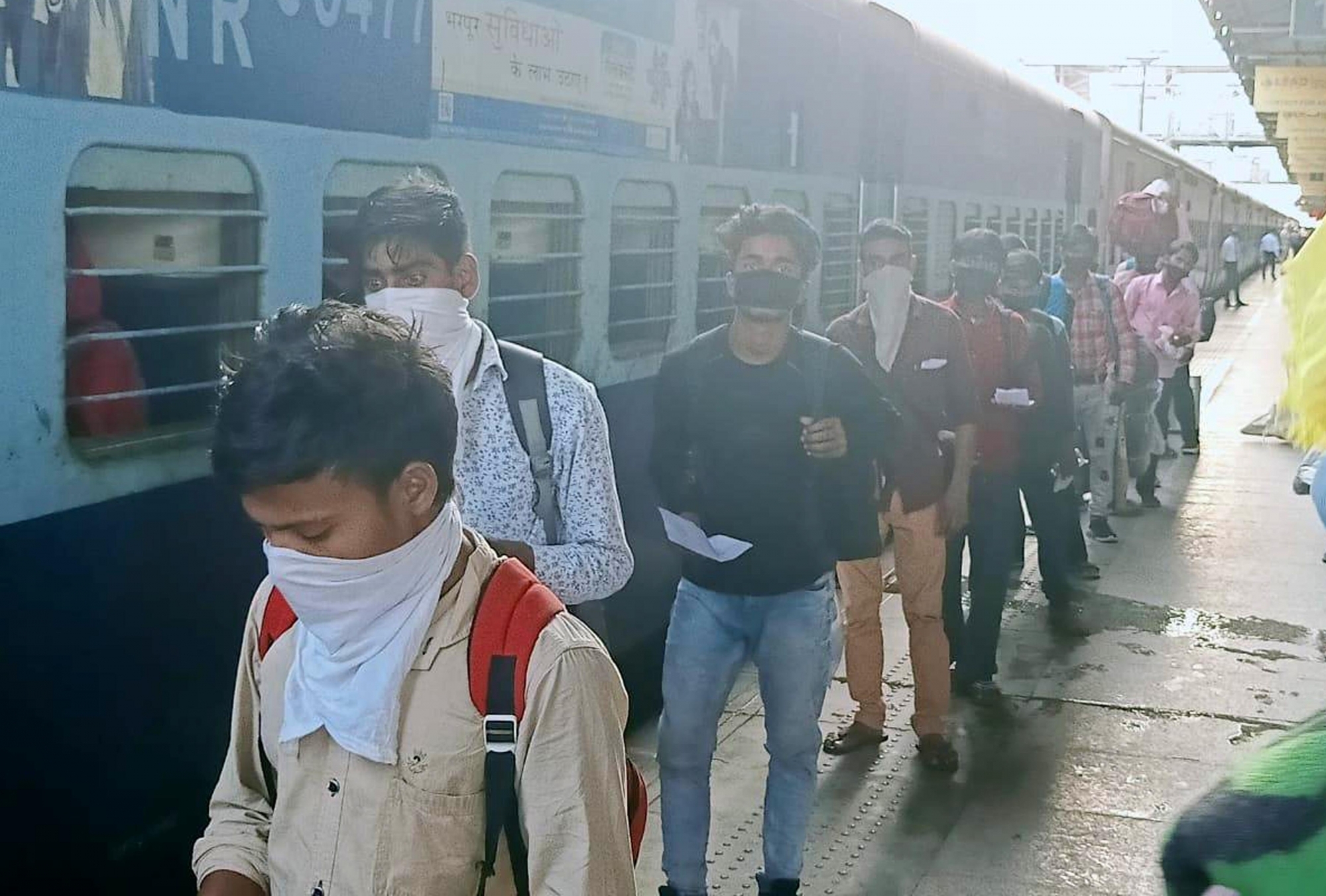 Amritsar: Migrant workers from Uttar Pradesh who were stranded in Punjab due to the ongoing nationwide lockdown imposed to mitigate the spread of coronavirus, arrive at Amritsar Junction railway station to board a Shramik Special train to Gonda, on May 7, 2020. (Photo: IANS)