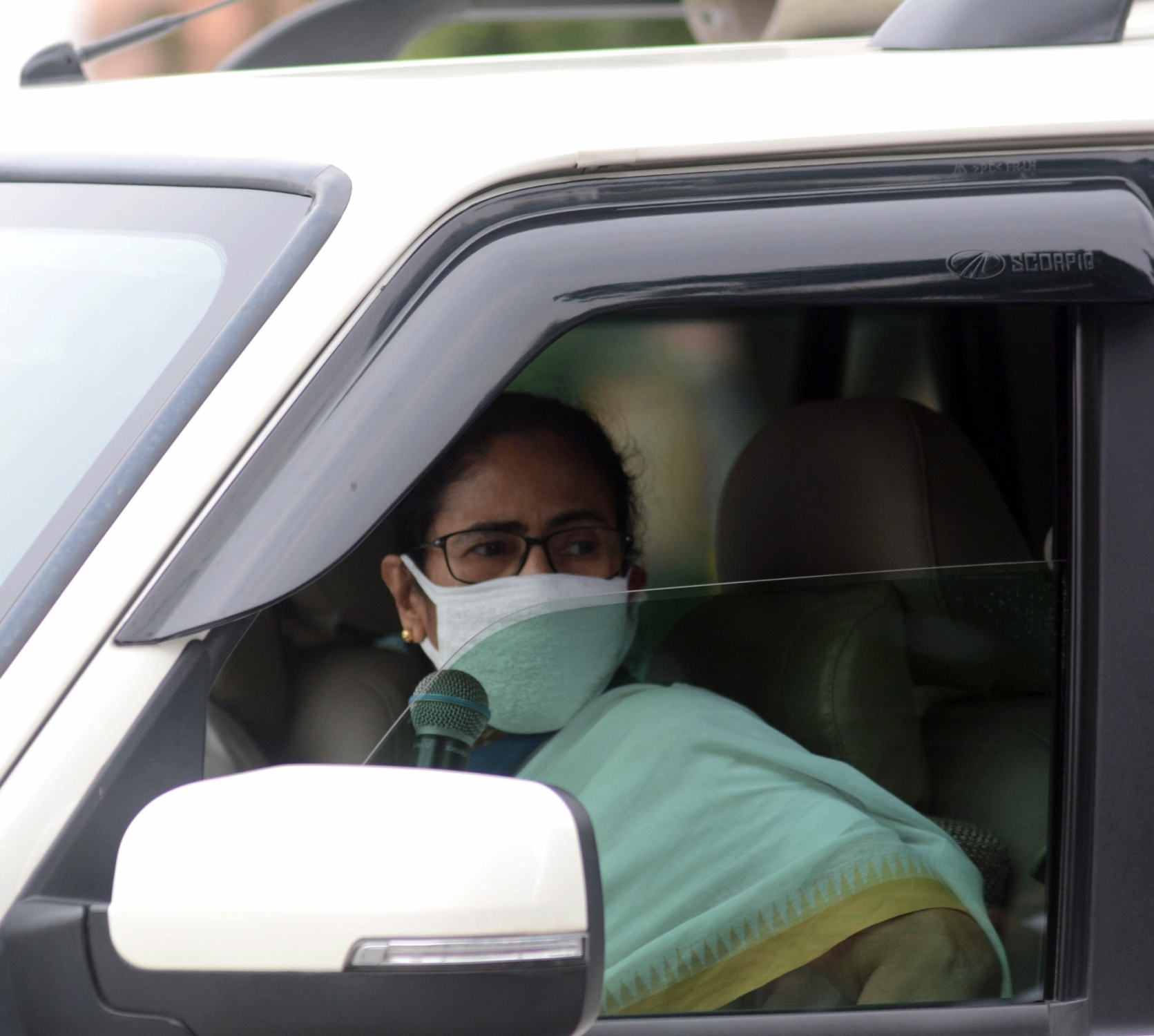 Kolkata: West Bengal Chief Minister Mamata Banerjee interacts with people from her cavalcade during her inspection round across Kolkata amid the extended nationwide lockdown imposed to mitigate the spread of coronavirus; on Apr 23, 2020. (Photo: IANS)