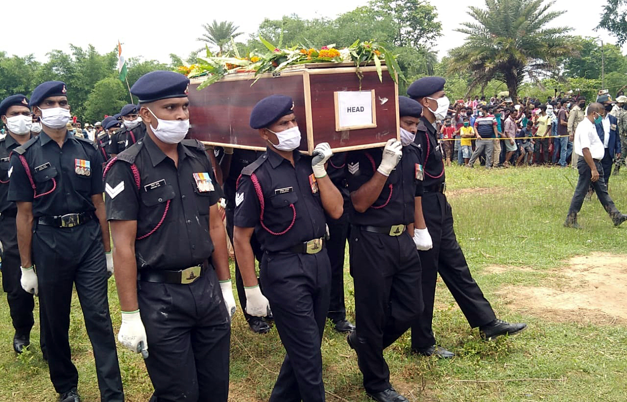 Army personnel carry the coffin of soldier Ganesh Hansda for his last rites