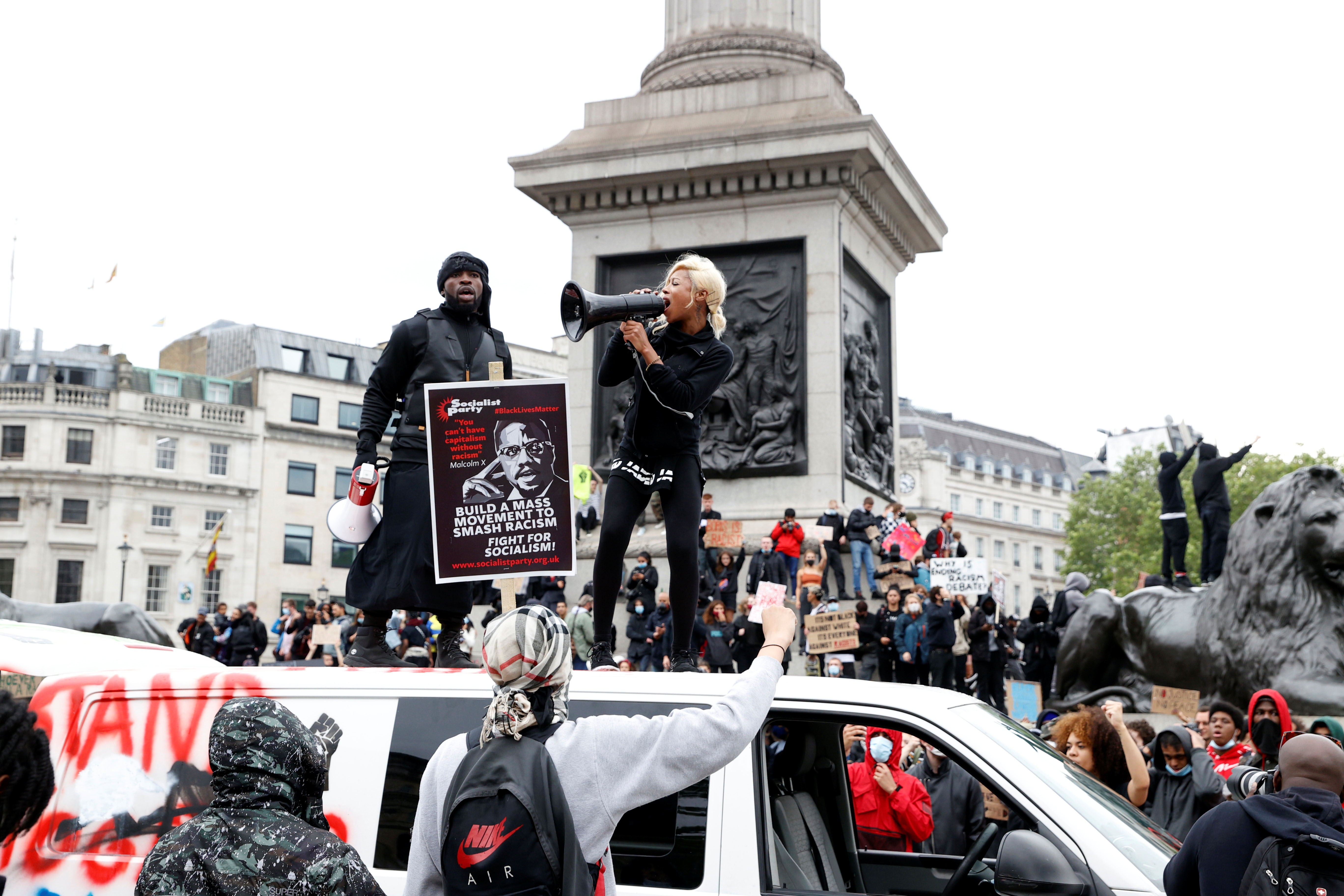 A demonstrator uses a megaphone during a Black Lives Matter