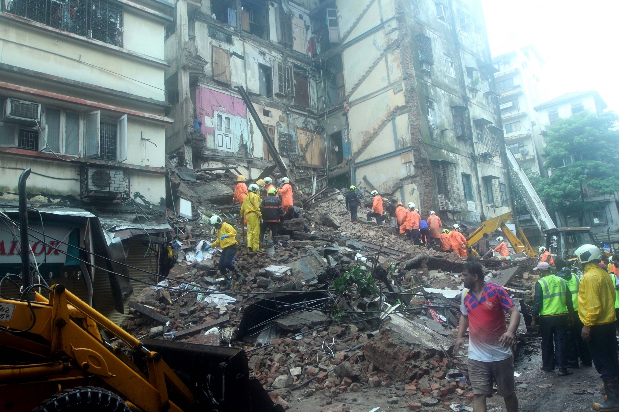 Mumbai: Rescue operations underway after a portion of the 80-year-old five-storied Bhanushali Building in Fort, near the GPO in South Mumbai collapsed killing 6 and injuring 18 persons, on July 16, 2020. (Photo: IANS)