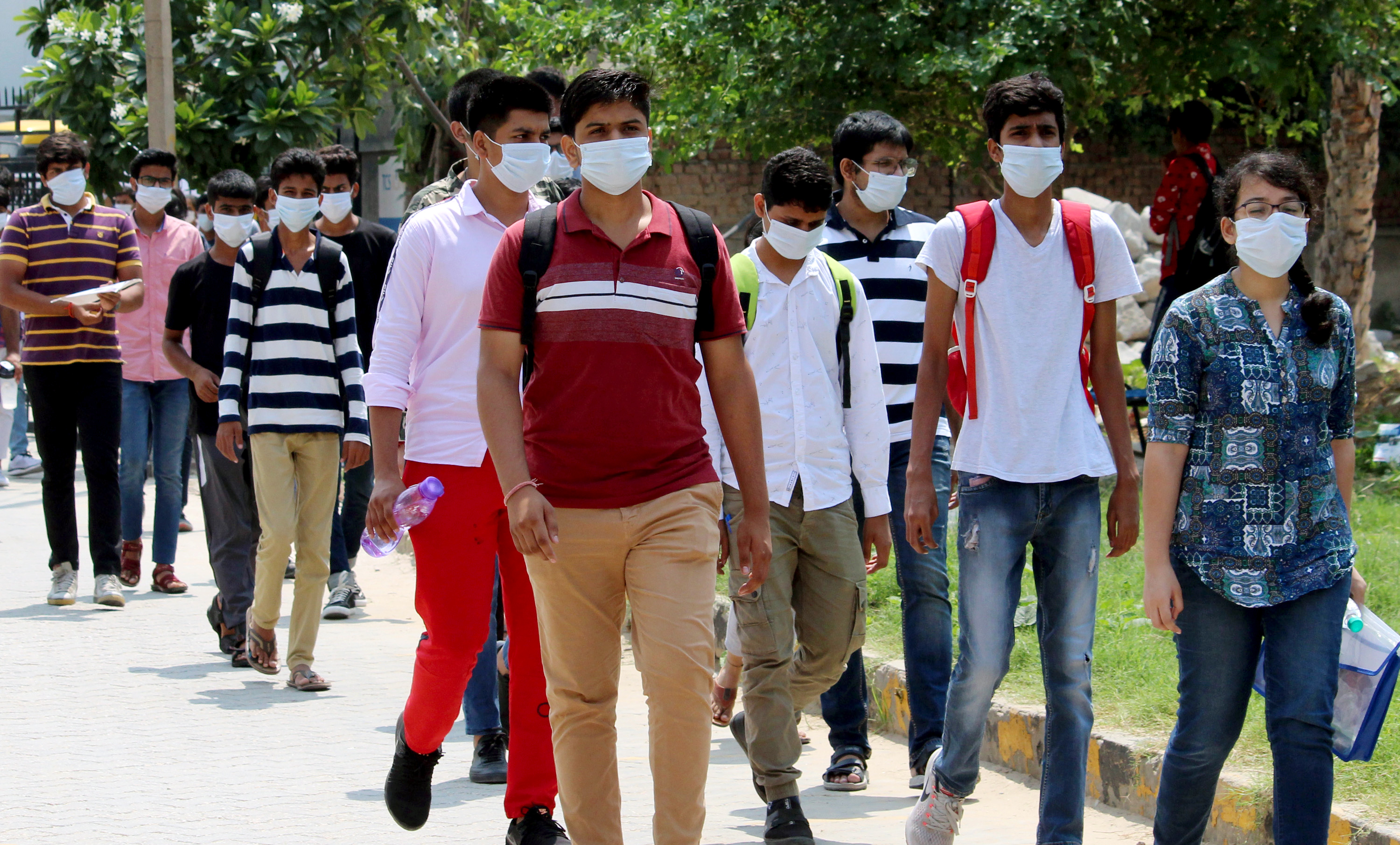 Students leave an examination centre