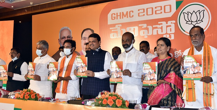 Maharashtra former Chief Minister Devendra Fadhnavis along with Bhupendra Yadav, BJP’s national general secretary, Rajya Sabha MP, and Telangana BJP Chief Bandi Sanjay Kumar, Union Minister of State for Home Affairs G. Kishan Reddy releasing the party m