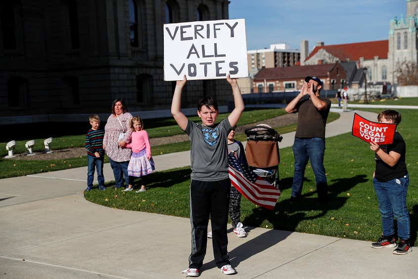 Supporters of U.S. President Donald Trump rally outside the State Capitol building as votes continue to be counted following the 2020 U.S. presidential election, in Lansing