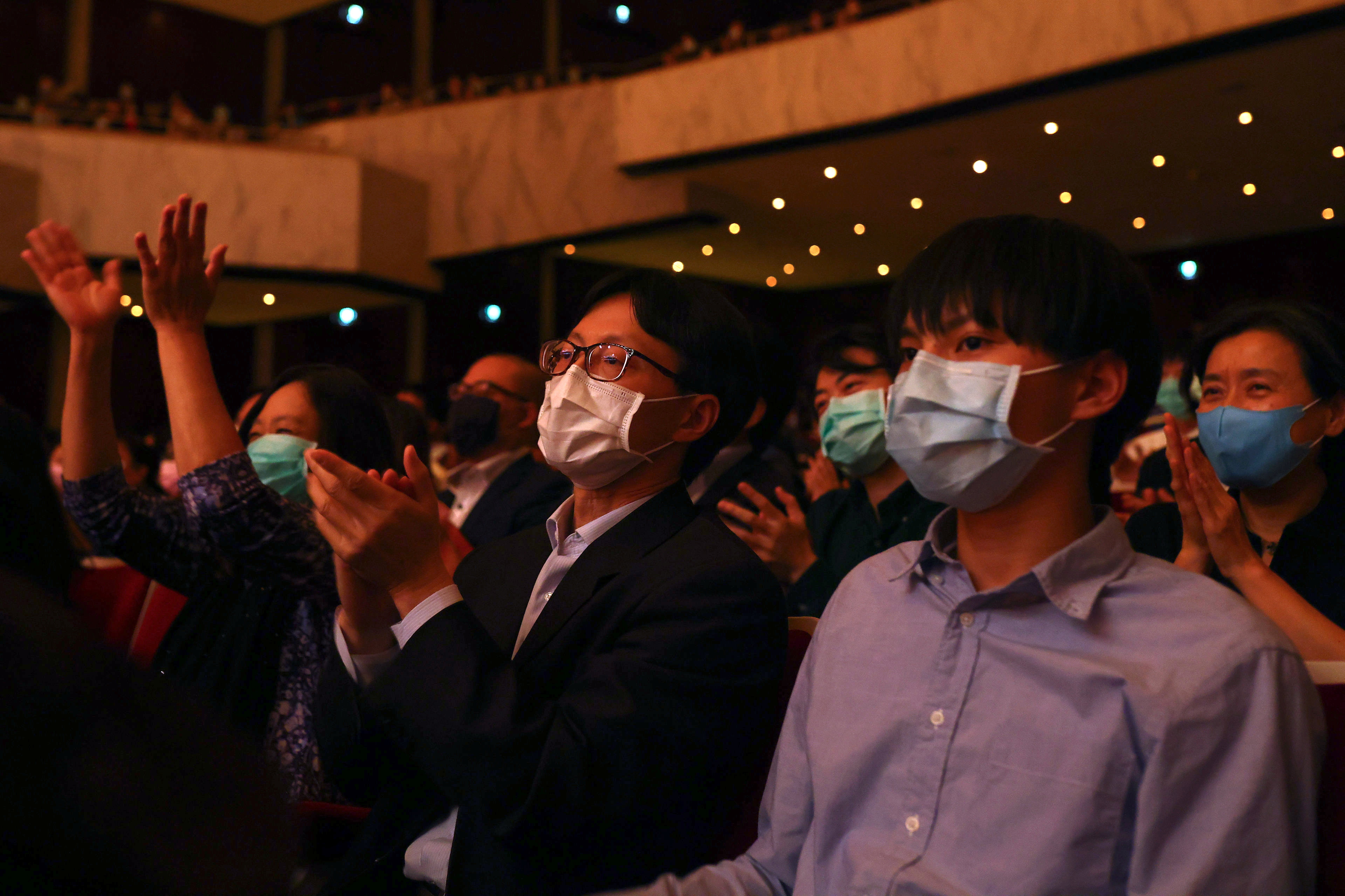 People wear protective masks to prevent the spread of the coronavirus disease (COVID-19) while attending a music concert at National Concert Hall in Taipei,
