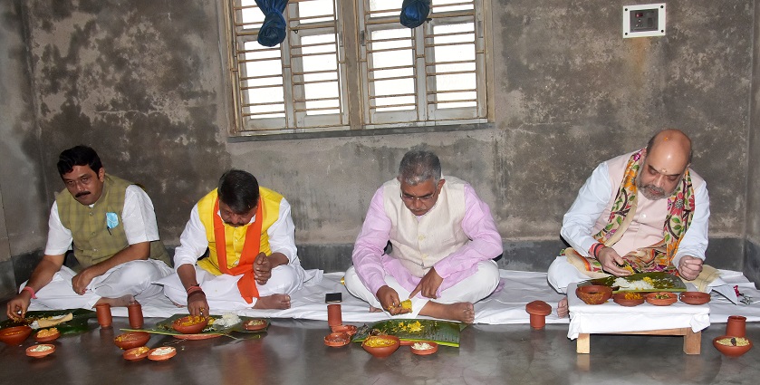 Union Home Minister Amit Shah, BJP state President Dilip Ghosh eat lunch at the house of Matua community,