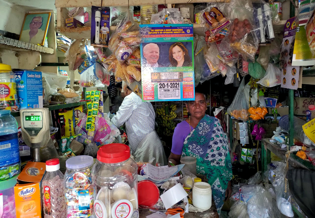 calender with printed face of Kamala Harris and Joe Biden displayed on a shop
