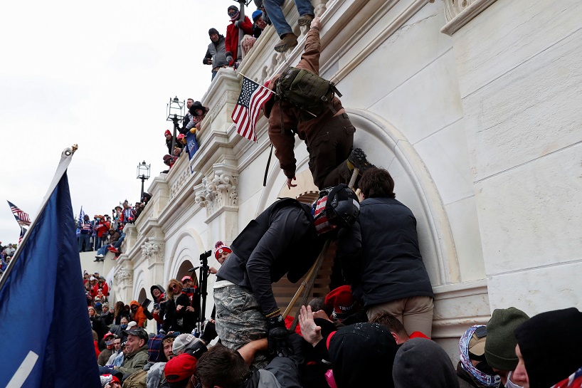 Pro-Trump protesters clash with police during a rally to contest the certification of the 2020 U.S. presidential election results by the U.S. Congress, at the U.S. Capitol Building in Washington