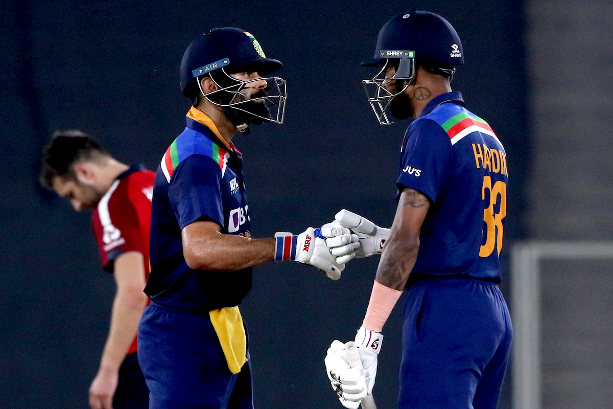 India's Virat Kohli and Hardik Pandya celebrate their partnership during the 5th and final T20 match
