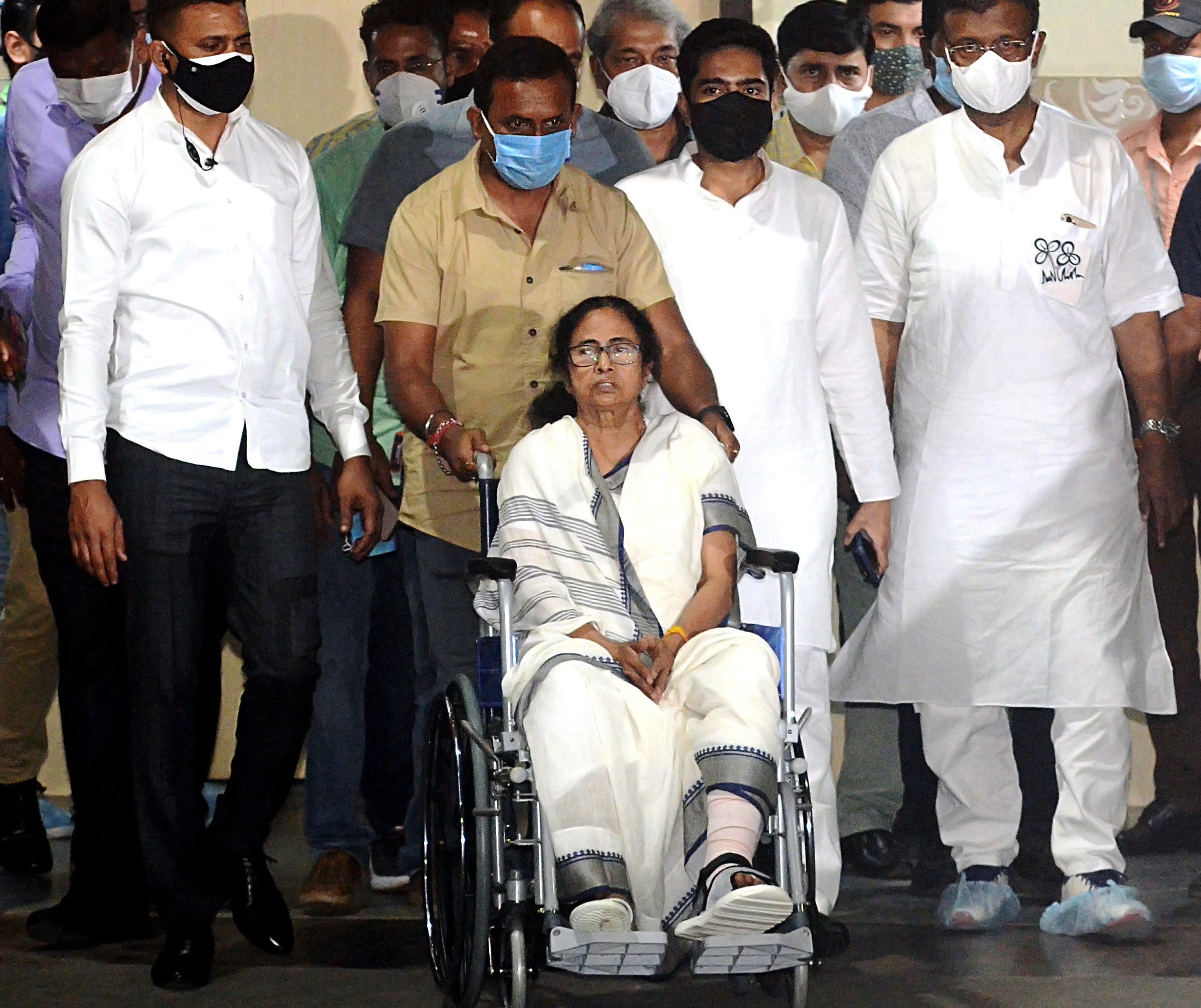 West Bengal Chief Minister Mamata Banerjee comes out on a wheelchair