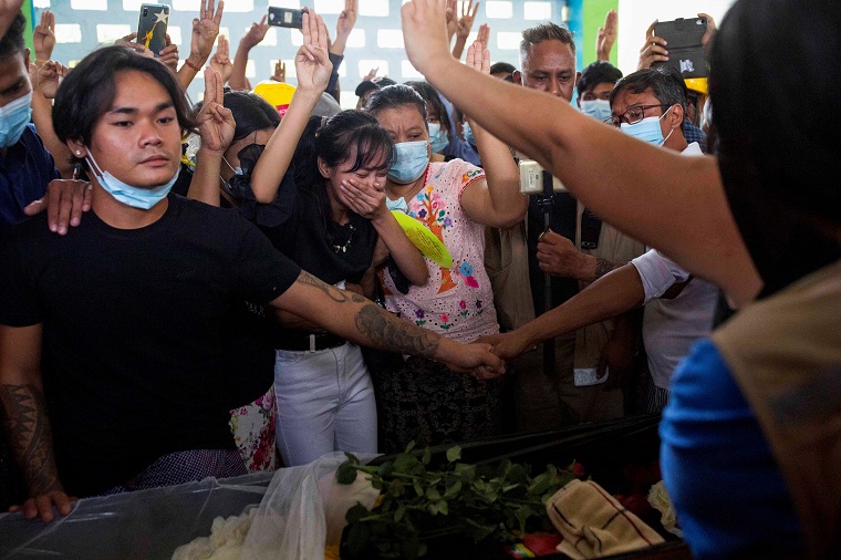 People attend a funeral of Chit Min Thu, who died in an anti-coup protest in North Dagon Township in Yangon