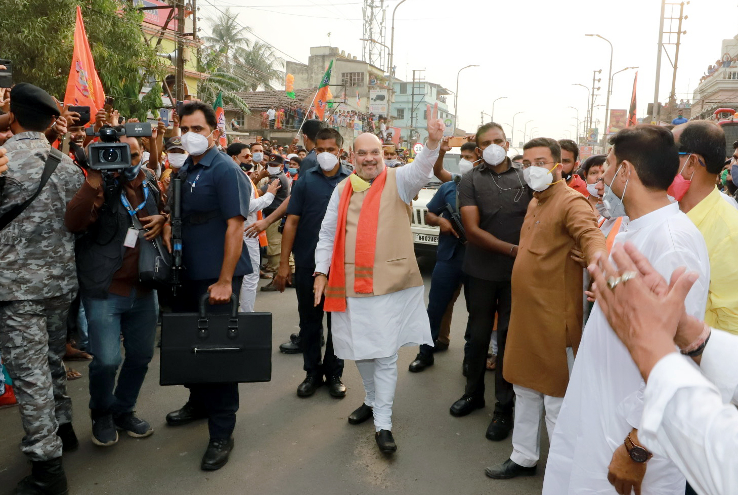 Union Home Minister Amit Shah shows victory sign