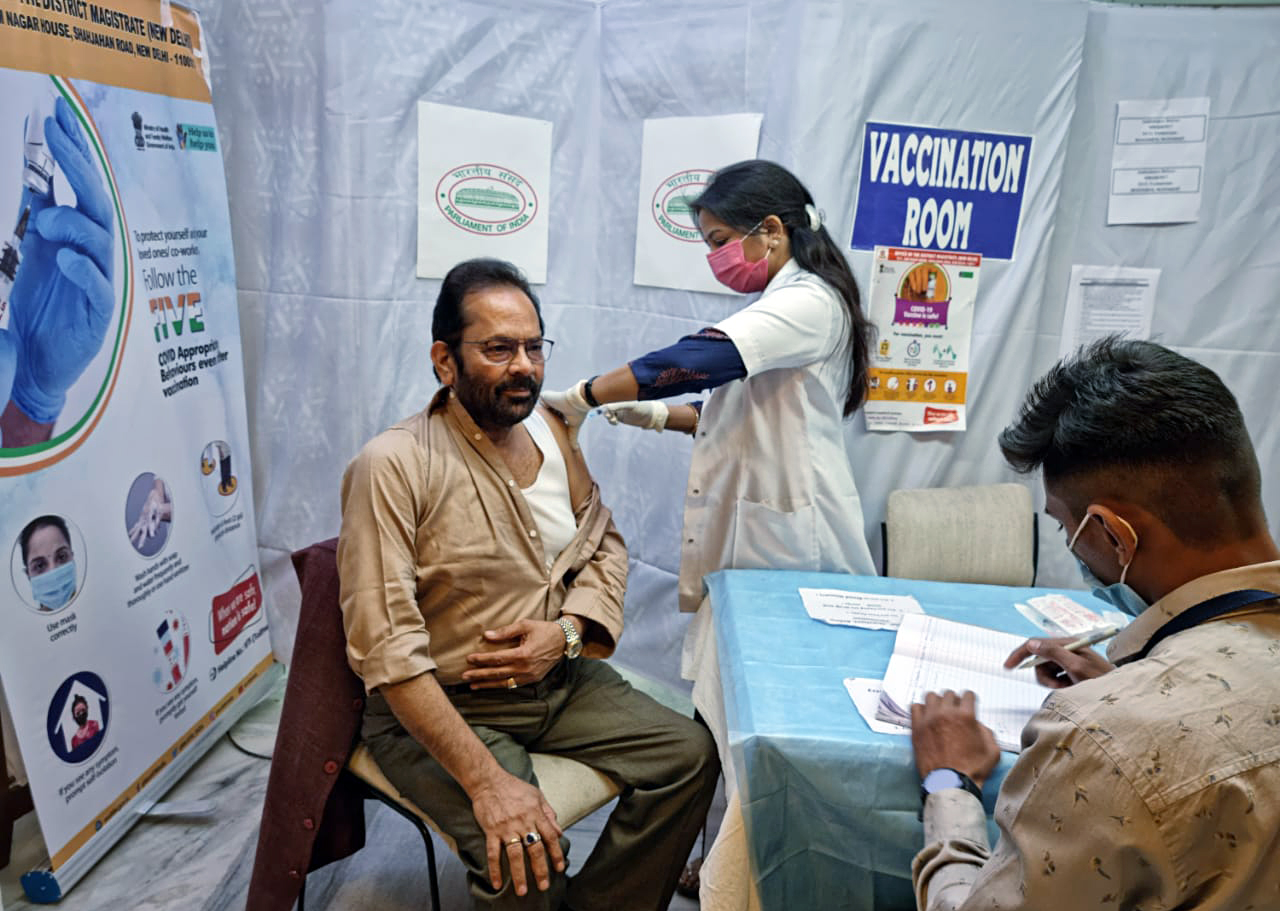 Union Minority Affairs Minister Mukhtar Abbas Naqvi receives a second dose of the COVID-19 vaccine