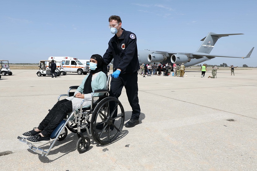Afghan citizens who have been evacuated from Kabul arrive at Naval Station (NAVSTA) Rota Air Base