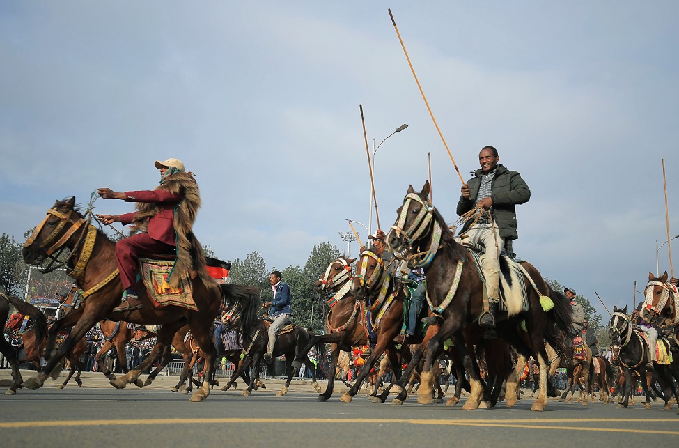 Men ride horses during a rally to support the National Defense Force at the Meskel Square in Addis Ababa