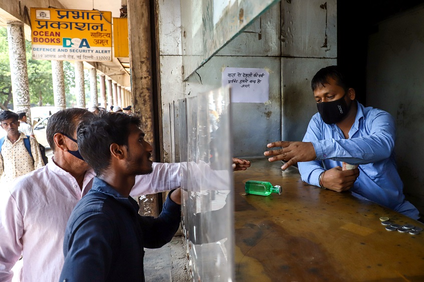 People buy liquor as private liquor shops to be shut from Oct 1st onwards