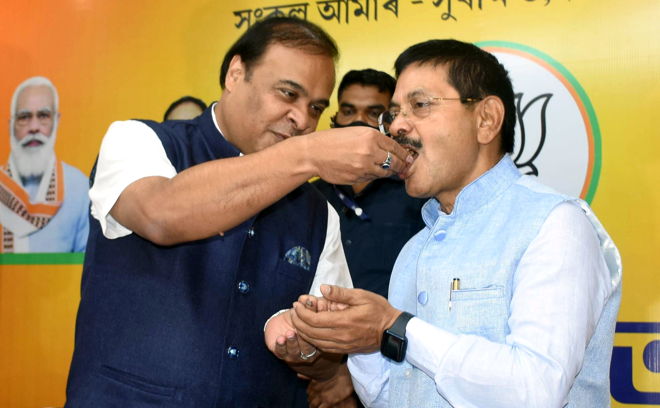 Assam Chief Minister Dr. Himanta Biswa Sarma offers sweets to Assam BJP General secretary Phanindra Nath