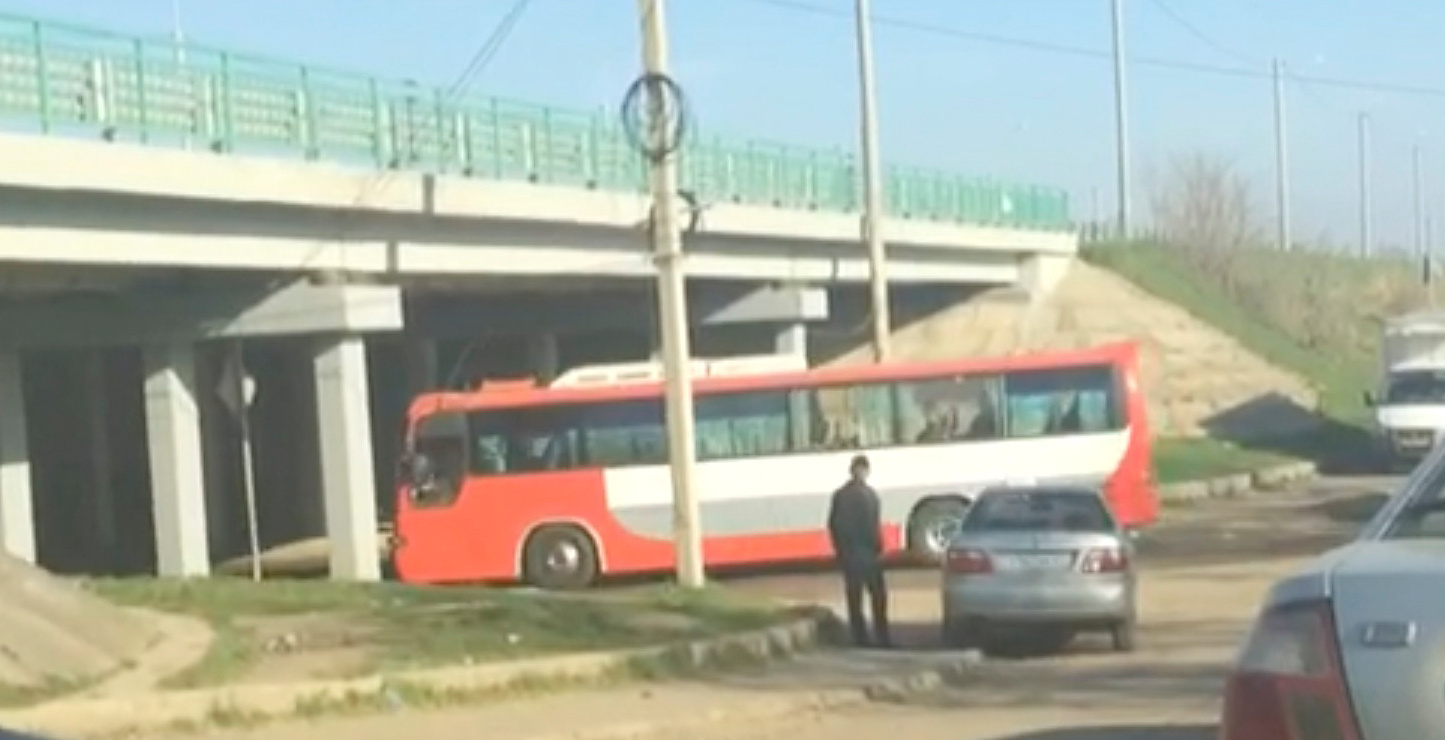 A still image from a video footage taken shows a bus transferring Russian private military contractors passing a checkpoint before entering the Defence Ministry base in Molkino